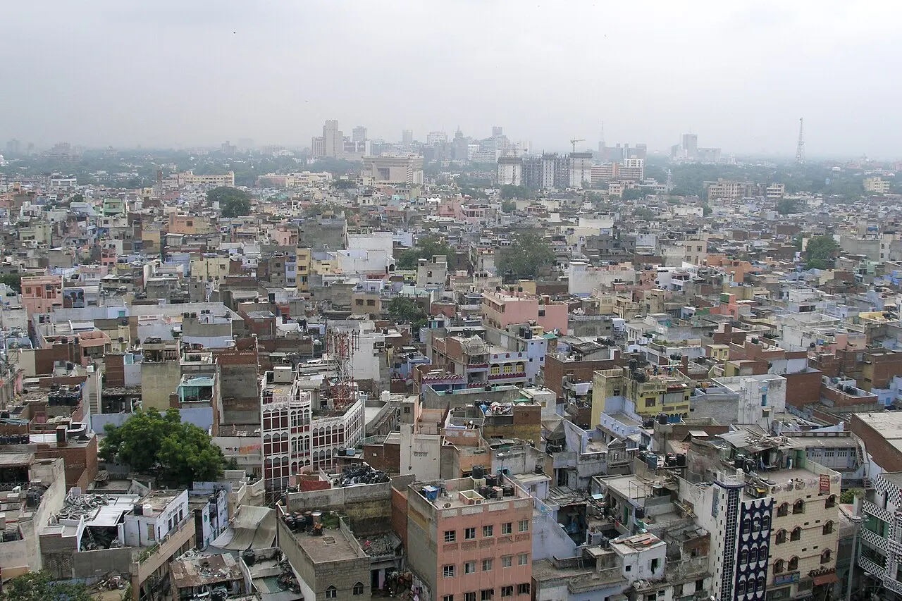 A dense city skyline viewed from a historic district