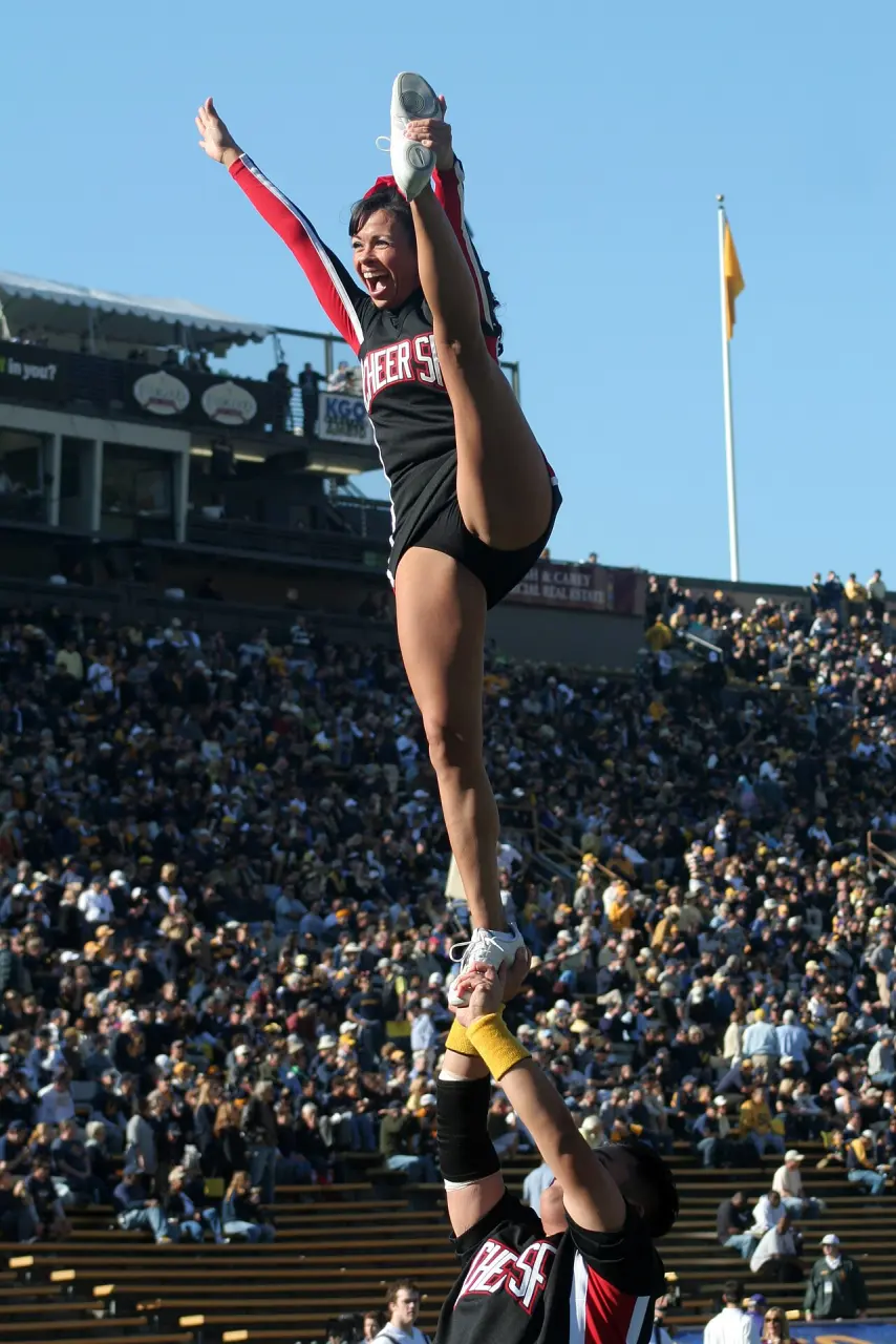 Female athlete performing a flexibility stunt